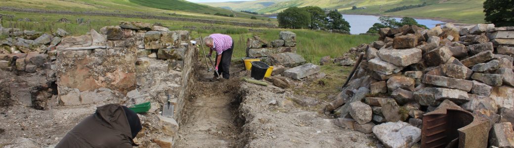 View towards Scar House reservoir with two people working on the Lodge excavation in the foreground